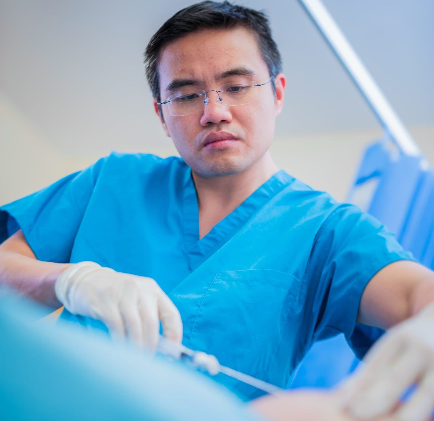 Surgeon performing cartilage cell implantation